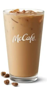 McDonald's Iced Coffee is made with 100% Arabica coffee, ice, milk, and flavored syrup, offering a refreshing, sweet pick-me-up with 140 calories per serving.